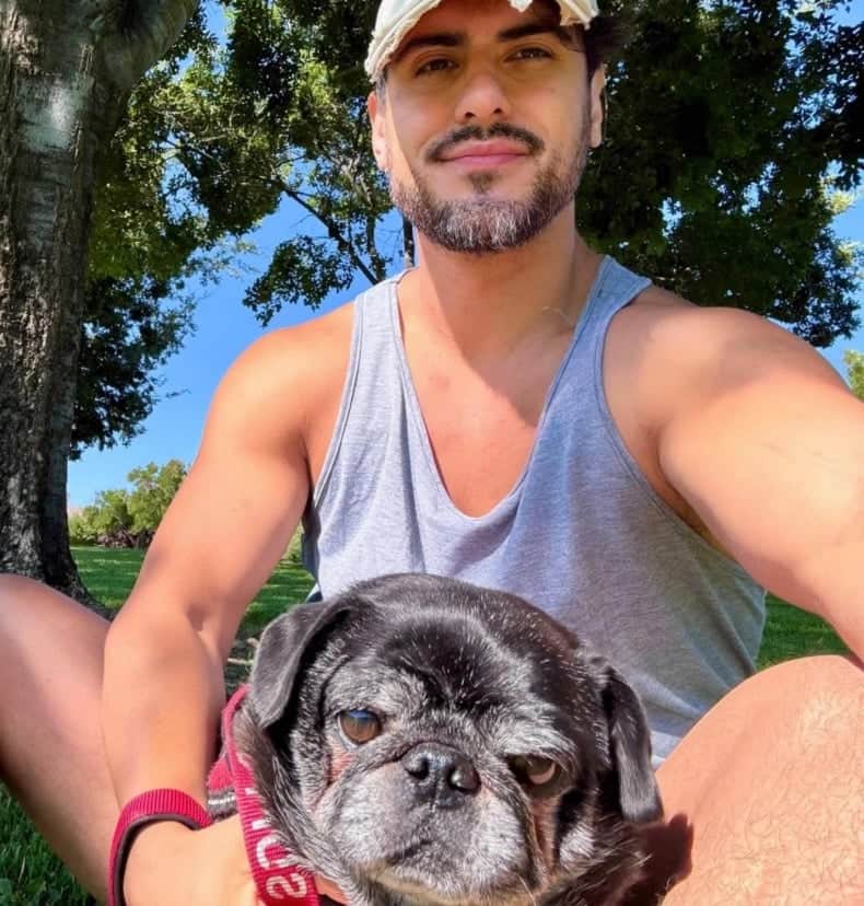 Tyler holding a senior pug